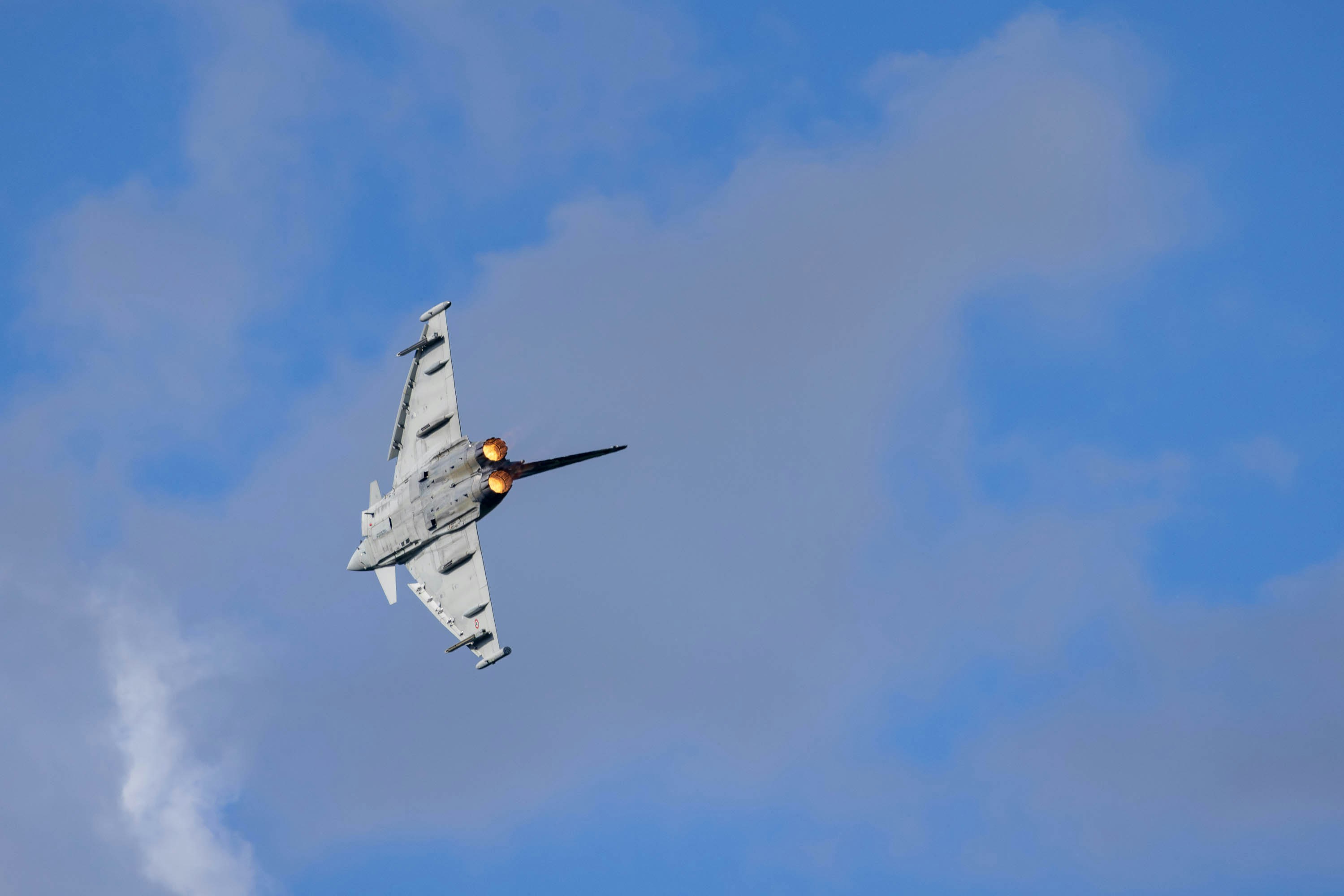 Eurofighter Typhoon multirole combat aircraft on a tactical sortie with afterburners engaged - type operated by multiple NATO member air forces