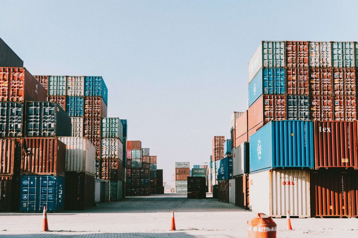 ISO container storage yard: rows of stacked shipping containers