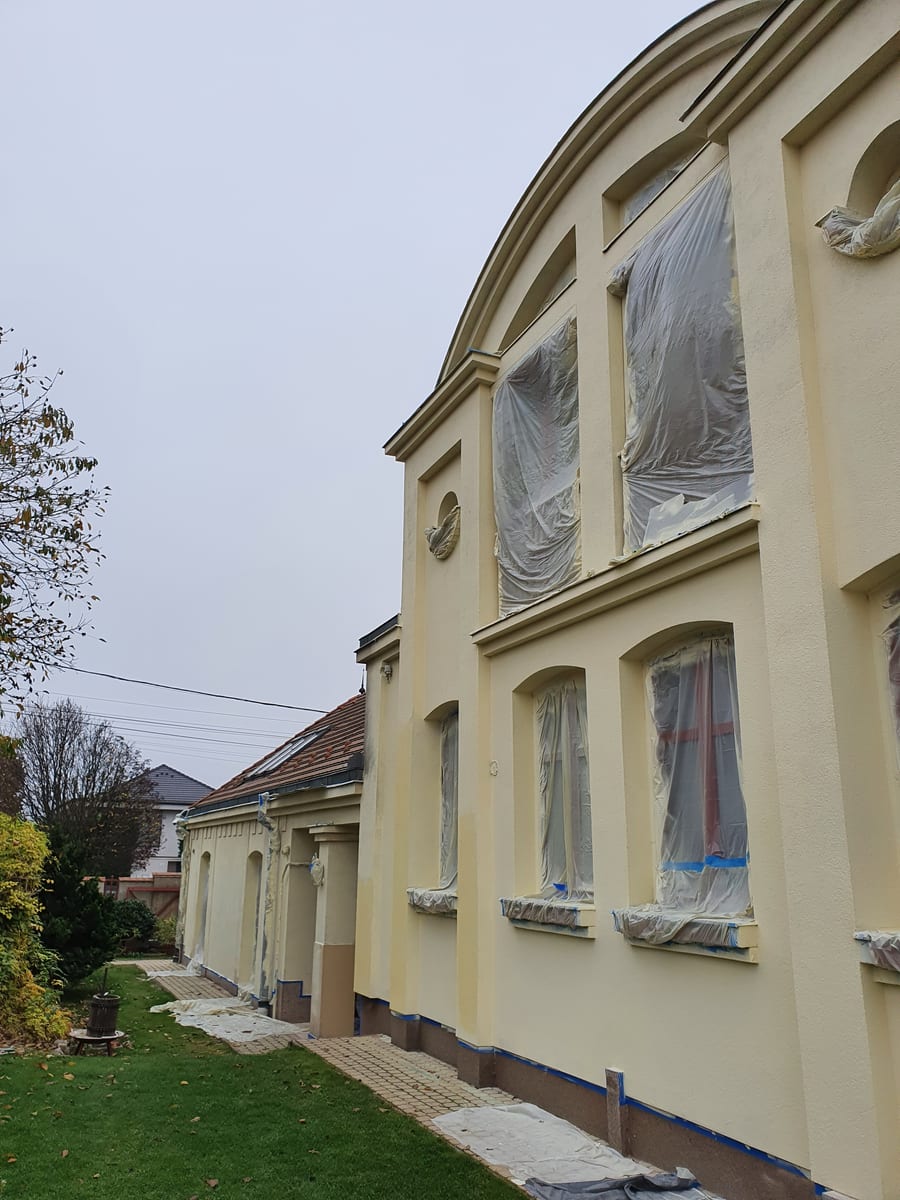 Listed heritage building with arched window surrounds and ornamented cornice, treated with GWR NANO INSULATION® coating, Gödöllő
